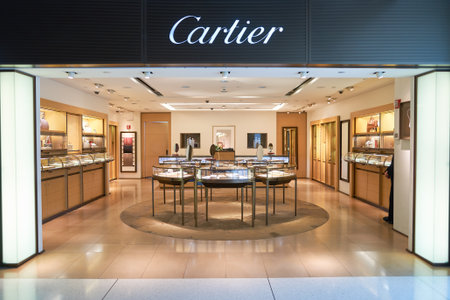 NEW YORK - APRIL 06, 2016: Cartier store in JFK Airport. Societe Cartier designs, manufactures,...