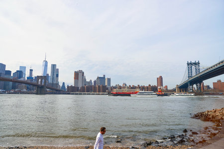 NEW YORK - CIRCA MARCH, 2016: Manhattan viewed from Brooklyn in the daytime. Manhattan is the most...