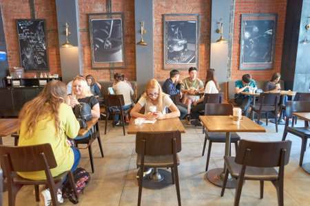 MOSCOW, RUSSIA- AUGUST 24, 2016: inside of Starbucks coffee shop. Starbucks Corporation is an American coffee company and coffeehouse chain.のeditorial素材