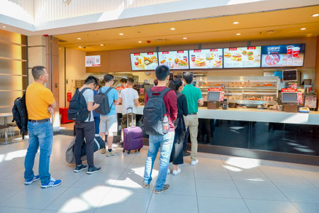 SHENZHEN, CHINA - MAY 11, 2016: KFC in Shenzhen Bao'an International Airport. Kentucky Fried Chicken, or just KFC, is a fast food restaurant chain that specializes in fried chicken.のeditorial素材