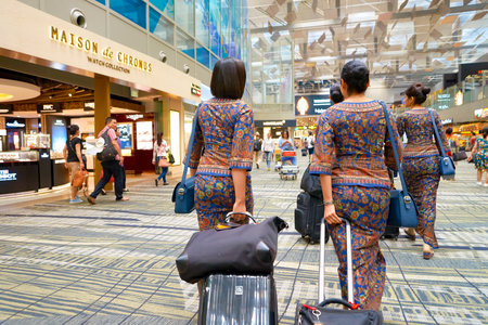 SINGAPORE - CIRCA AUGUST, 2016: Singapore Airlines crew members at Changi Aiport. Changi Airport is the primary civilian airport for Singapore.のeditorial素材