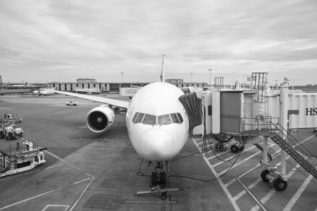 NEW YORK - APRIL 06, 2016: passenger jet airplane docked at JFK Airport. John F. Kennedy International Airport is a major international airport located in the borough of Queens in New York City, United States.のeditorial素材
