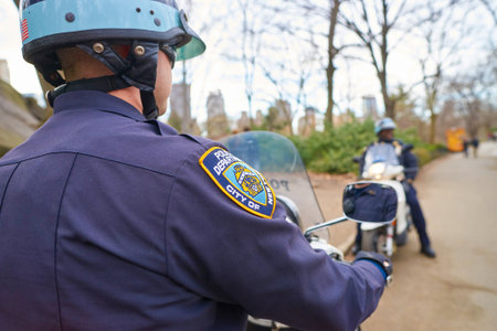 NEW YORK - CIRCA MARCH, 2016: NYPD sleeve patch shield on a police officer patrol in Central Park. The New York City Police Department (NYPD or NYCPD) is the largest municipal police force in the United States.のeditorial素材