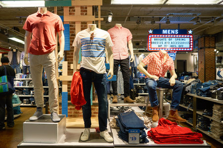 NEW YORK - MARCH 18, 2016: inside of Old Navy store in New York. Old Navy is an American clothing and accessories retailer owned by American multinational corporation Gap Inc.のeditorial素材