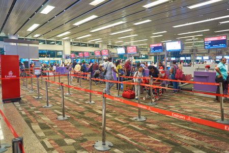 SINGAPORE - AUGUST 28, 2016: Emirates check-in counters at Singapore Changi Airport. Emirates is an...