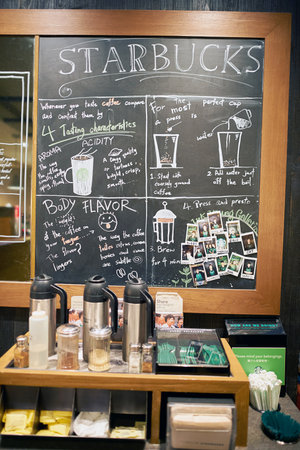 HONG KONG - CIRCA JANUARY, 2016: blackboard inside of Starbucks store in Hong Kong. Starbucks Corporation is an American coffee company and coffeehouse chain.のeditorial素材