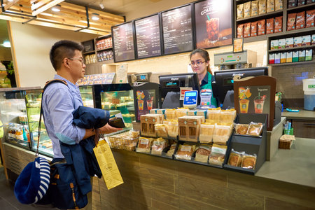 SINGAPORE - CIRCA AUGUST, 2016: Starbucks at Singapore Changi Airport. Starbucks Corporation is an American coffee company and coffeehouse chain.のeditorial素材