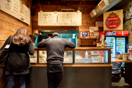 NEW YORK - MARCH 18, 2016: inside of Tres Carnes - 688 6th Ave, New York. Tres Carnes is a barbeque eatery offering authentic Texas Smoked Mexican Fare.のeditorial素材