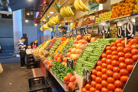 BARCELONA, SPAIN - NOVEMBER 20, 2015: fruits and vegetables for sale at La Boqueria. The Mercat de Sant Josep de la Boqueria is a large public market and one of the city's foremost tourist landmark in Barcelona.のeditorial素材