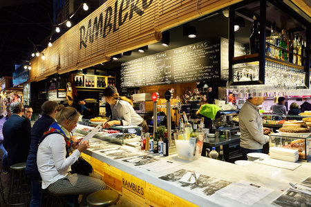 BARCELONA, SPAIN - NOVEMBER 20, 2015: inside La Boqueria in Barcelona. The Mercat de Sant Josep de la Boqueria is a large public market and one of the city's foremost tourist landmark in Barcelona.のeditorial素材