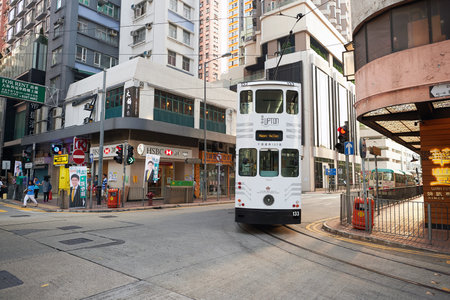 HONG KONG - OCTOBER 25, 2015: double-decker tramway in Hong Kong. Hong Kong is an autonomous territory on the southern coast of China at the Pearl River Estuary and the South China Sea.のeditorial素材