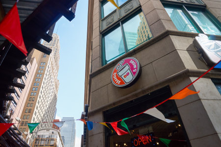 CHICAGO, IL - CIRCA MARCH, 2016: Dunkin' Donuts sign on wall of a building. Dunkin' Donuts is an American global donut company and coffeehouse chain.のeditorial素材