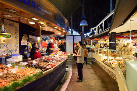BARCELONA, SPAIN - NOVEMBER 20, 2015: inside La Boqueria in Barcelona. The Mercat de Sant Josep de la Boqueria is a large public market and one of the city's foremost tourist landmark in Barcelona.のeditorial素材