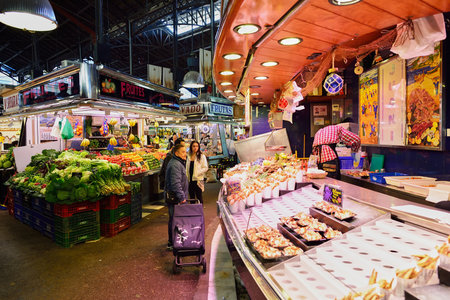 BARCELONA, SPAIN - NOVEMBER 20, 2015: inside La Boqueria in Barcelona. The Mercat de Sant Josep de la Boqueria is a large public market and one of the city's foremost tourist landmark in Barcelona.のeditorial素材