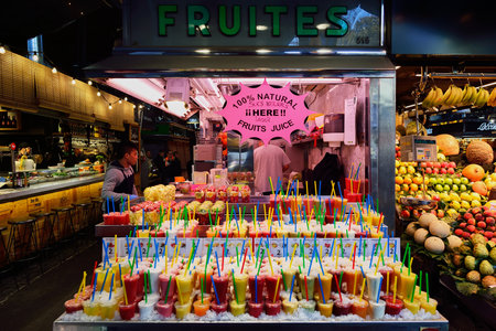 BARCELONA, SPAIN - NOVEMBER 20, 2015: fresh juices at La Boqueria in Barcelona. The Mercat de Sant Josep de la Boqueria is a large public market and one of the city's foremost tourist landmark in Barcelona.のeditorial素材
