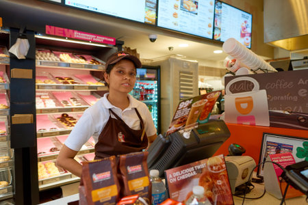 CHICAGO, IL - CIRCA MARCH, 2016: indoor portrait of staff at Dunkin' Donuts in Chicago. Dunkin' Donuts is an American global donut company and coffeehouse chain.のeditorial素材