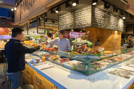 BARCELONA, SPAIN - NOVEMBER 20, 2015: inside La Boqueria in Barcelona. The Mercat de Sant Josep de la Boqueria is a large public market and one of the city's foremost tourist landmark in Barcelona.のeditorial素材