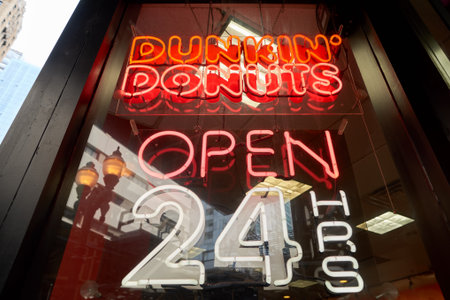 CHICAGO, IL - CIRCA MARCH, 2016: close up shot of Dunkin' Donuts open 24 hours sign. Dunkin' Donuts is an American global donut company and coffeehouse chain.のeditorial素材