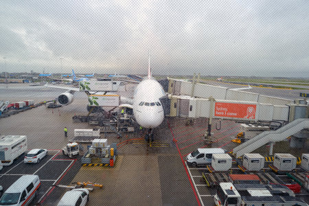 AMSTERDAM, NETHERLANDS - CIRCA NOVEMBER, 2015: Emirates A380 docked at Amsterdam Airport Schiphol. The Airbus A380 is a double-deck, wide-body, four-engine jet airliner.のeditorial素材