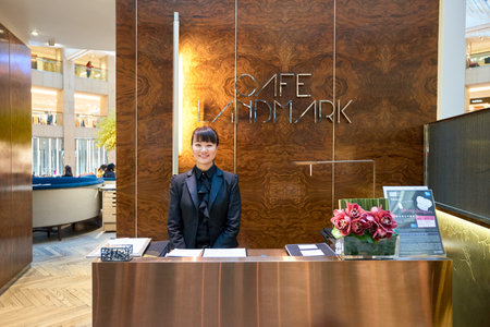HONG KONG - CIRCA JANUARY, 2016: indoor portrait of a staff at Cafe Landmark at The Landmark shopping mall. The Landmark is one of the oldest and most prominent shopping malls in Hong Kong.のeditorial素材
