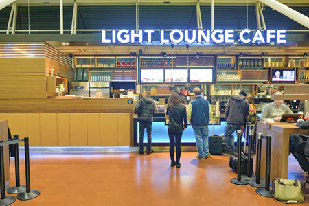 AMSTERDAM, NETHERLANDS - CIRCA NOVEMBER, 2015: Light Lounge Cafe at Schiphol Airport. Amsterdam Airport Schiphol is the main international airport of the Netherlands.のeditorial素材