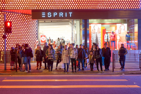 HONG KONG - CIRCA JANUARY, 2016: people waiting to cross the street in Hong Kong. Hong Kong is an autonomous territory on the southern coast of China at the Pearl River Estuary and the South China Sea.のeditorial素材