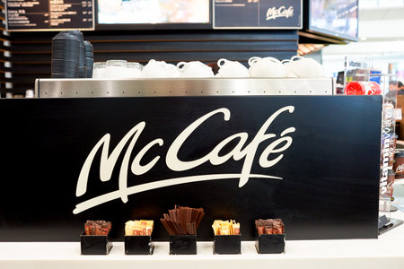 HONG KONG - CIRCA NOVEMBER, 2016: McCafe sign at Hong Kong International Airport. McCafe is a coffee-house-style food and drink chain, owned by McDonald's.のeditorial素材