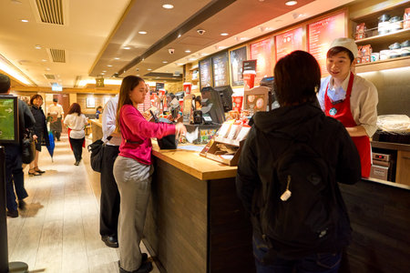 HONG KONG - CIRCA NOVEMBER, 2016: inside a Starbucks cafe in Hong Kong. Starbucks Corporation is an...
