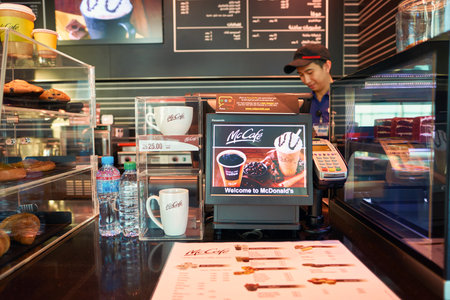 DUBAI, UAE - CIRCA NOVEMBER, 2016: McCafe at Dubai International Airport. McCafe is a coffee-house-style food and drink chain, owned by McDonald's.のeditorial素材