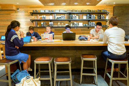 HONG KONG - CIRCA NOVEMBER, 2016: inside a Starbucks cafe in Hong Kong. Starbucks Corporation is an...