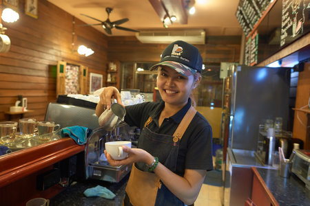 PATTAYA, THAILAND - CIRCA FEBRUARY, 2016: barista at Coffee Mania coffee shop in Pattaya.のeditorial素材
