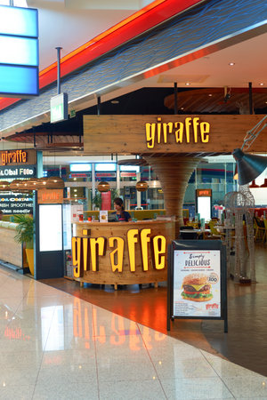 DUBAI, UAE - CIRCA NOVEMBER, 2016: inside Dubai Airport. There are a lot of restaurants, bars, cafes and shops in Dubai International Airport. Almost all of them are open twenty-four hours.のeditorial素材
