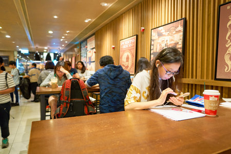HONG KONG - CIRCA NOVEMBER, 2016: a Starbucks cafe in Hong Kong. Starbucks Corporation is an American coffee company and coffeehouse chain.のeditorial素材
