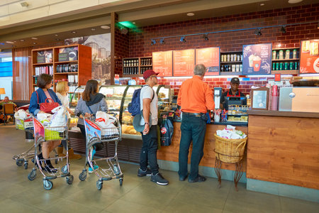 DUBAI - CIRCA NOVEMBER, 2016: a Starbucks cafe in Dubai International Airport. Starbucks Corporation...