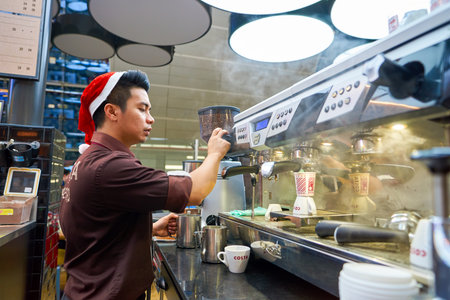 DUBAI, UAE - CIRCA NOVEMBER, 2016: barista at a Costa Coffee branch at Dubai international Airport. Costa Coffee is a British multinational coffeehouse company, it is the second largest coffeehouse chain in the world behind Starbucks and the largest in Brのeditorial素材