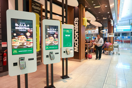 DUBAI, UAE - CIRCA NOVEMBER, 2016: Mcdonald's ordering kiosks at Dubai International Airport. McDonald's is an American hamburger and fast food restaurant chain.のeditorial素材