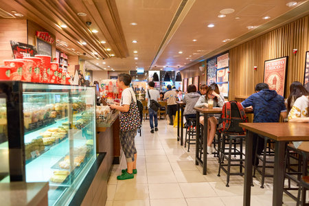 HONG KONG - CIRCA NOVEMBER, 2016: a Starbucks cafe in Hong Kong. Starbucks Corporation is an American coffee company and coffeehouse chain.のeditorial素材
