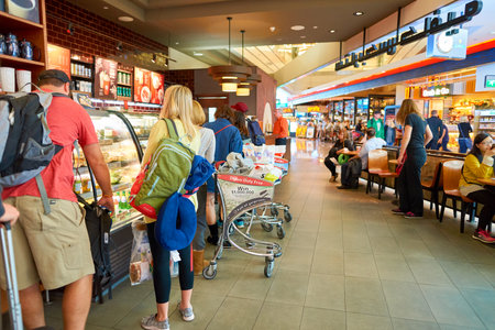 DUBAI - CIRCA NOVEMBER, 2016: a Starbucks cafe in Dubai International Airport. Starbucks Corporation is an American coffee company and coffeehouse chain.のeditorial素材