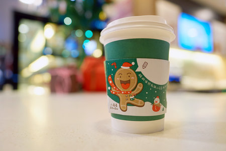 SHENZHEN, CHINA - CIRCA DECEMBER, 2016: McDonald's holday cup at McCafe in Shenzhen. McCafe is a coffee-house-style food and drink chain, owned by McDonald's.のeditorial素材