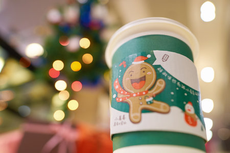 SHENZHEN, CHINA - CIRCA DECEMBER, 2016: McDonald's holday cup at McCafe in Shenzhen. McCafe is a coffee-house-style food and drink chain, owned by McDonald's.のeditorial素材