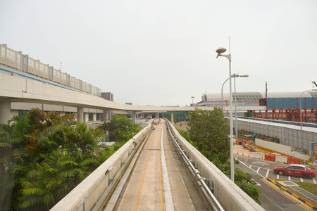 SINGAPORE - CIRCA NOVEMBER, 2015: view from Changi Airport Skytrain. The Changi Airport Skytrain is an automated people mover that connects Terminals 1, 2 and 3 at Singapore Changi Airport.のeditorial素材