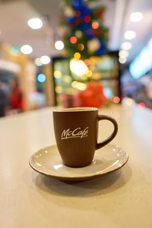SHENZHEN, CHINA - CIRCA DECEMBER, 2016: cup with logo of McCafe. McCafe is a coffee-house-style food...