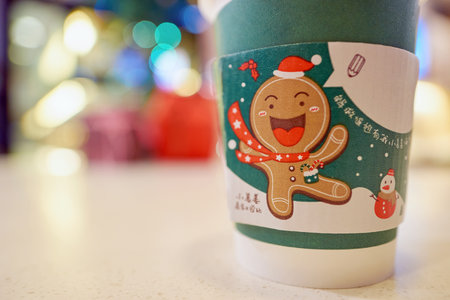 SHENZHEN, CHINA - CIRCA DECEMBER, 2016: McDonald's holday cup at McCafe in Shenzhen. McCafe is a coffee-house-style food and drink chain, owned by McDonald's.のeditorial素材