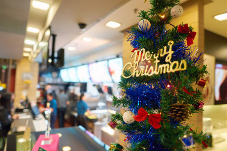 SHENZHEN, CHINA - CIRCA DECEMBER, 2016: Christmas tree at a McDonald's restaurant. McDonald's is an...