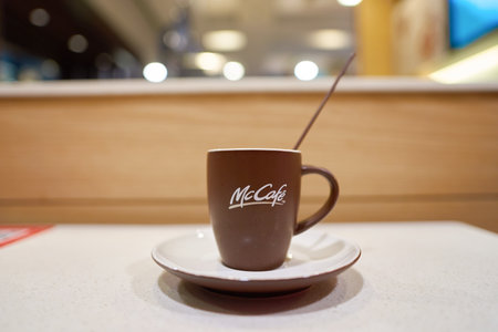 SHENZHEN, CHINA - CIRCA DECEMBER, 2016: close up shot of a cup at McCafe. McCafe is a coffee-house-style food and drink chain, owned by McDonald's.のeditorial素材