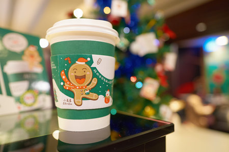 SHENZHEN, CHINA - CIRCA DECEMBER, 2016: McDonald's holday cup at McCafe in Shenzhen. McCafe is a coffee-house-style food and drink chain, owned by McDonald's.のeditorial素材
