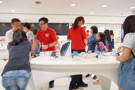 HONG KONG - CIRCA NOVEMBER, 2016: people at SmarTone shop. SmarTone Telecommunications Holdings Limited is a wireless communications carrier with operating subsidiaries in Hong Kong and Macau.のeditorial素材