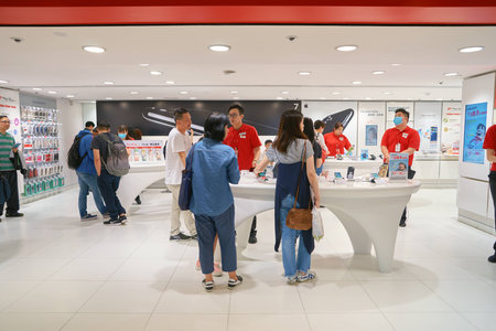 HONG KONG - CIRCA NOVEMBER, 2016: people at SmarTone shop. SmarTone Telecommunications Holdings Limited is a wireless communications carrier with operating subsidiaries in Hong Kong and Macau.のeditorial素材