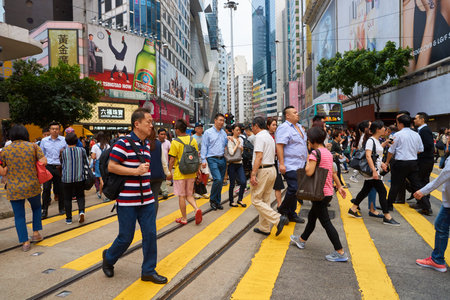 HONG KONG - CIRCA NOVEMBER, 2016: crowd of people walking crossing road in Hong Kong.のeditorial素材
