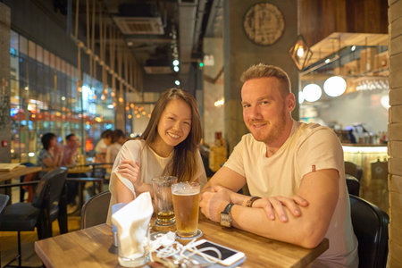 HONG KONG - OCTOBER 25, 2015: indoor portrait of two people at Kennedy Town. Kennedy Town is at the western end of Sai Wan on Hong Kong Islandのeditorial素材